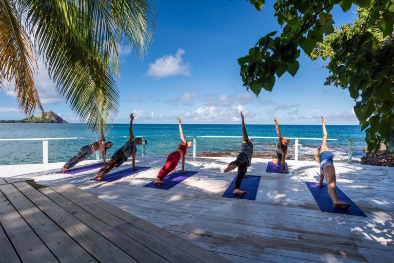 Yoga-on-beach-front-St.-Lucia-by-Art-In-Voyage-Wellness Retreat | The Year of Wellness Travel is Upon Us